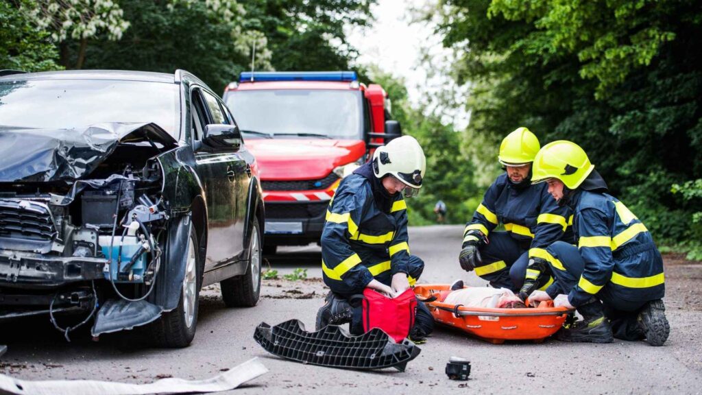 firefighters-helping-a-young-injured-woman-after-a-car-accident-image-E5YDZG3.jpeg